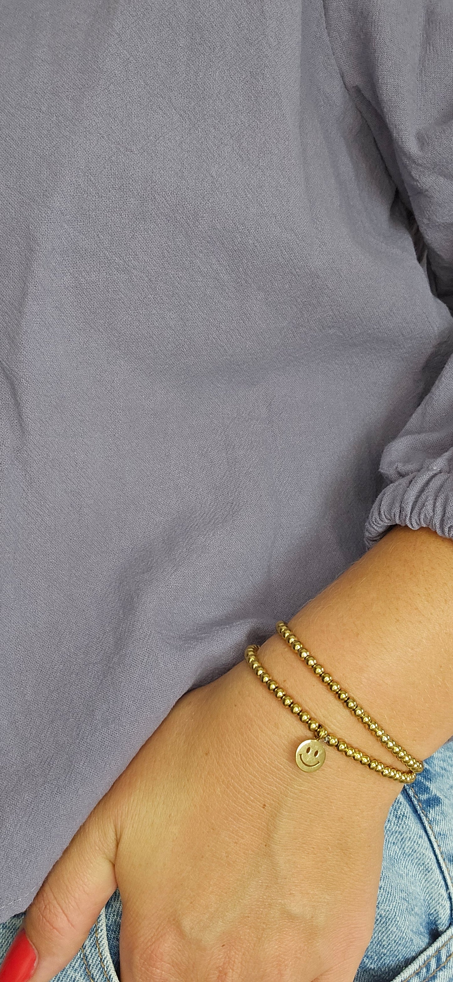 Armband smiley - goud